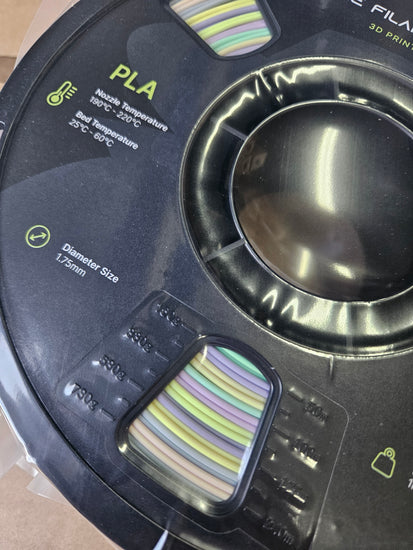 Close-up of a 3D printing filament spool with PLA label