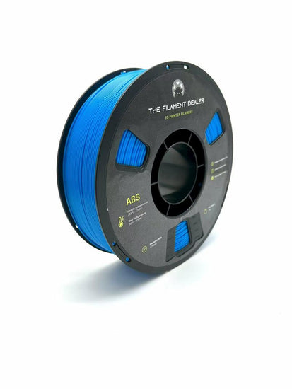 Spool of blue ABS filament on a white background with 'The Filament Dealer' branding.