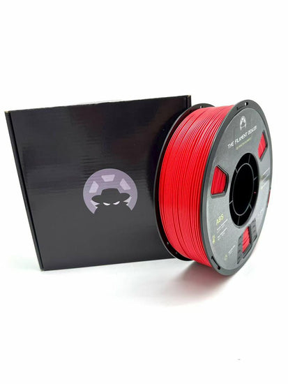 Red spool of filament with a black box on a white background