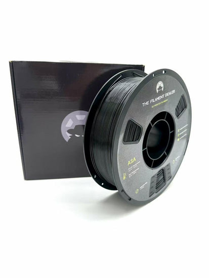 Spool of filament with a black box on a white background