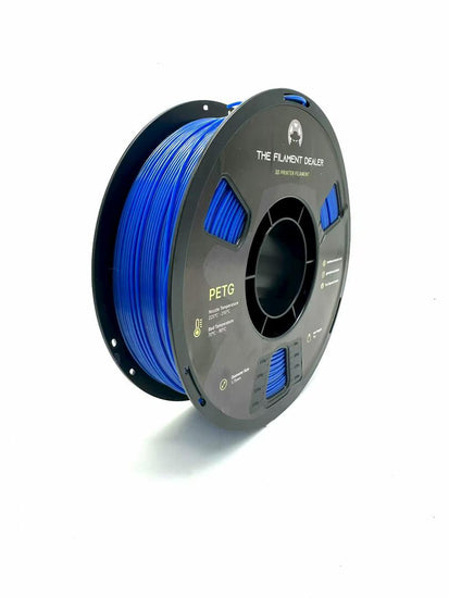 Spool of blue filament on a white background
